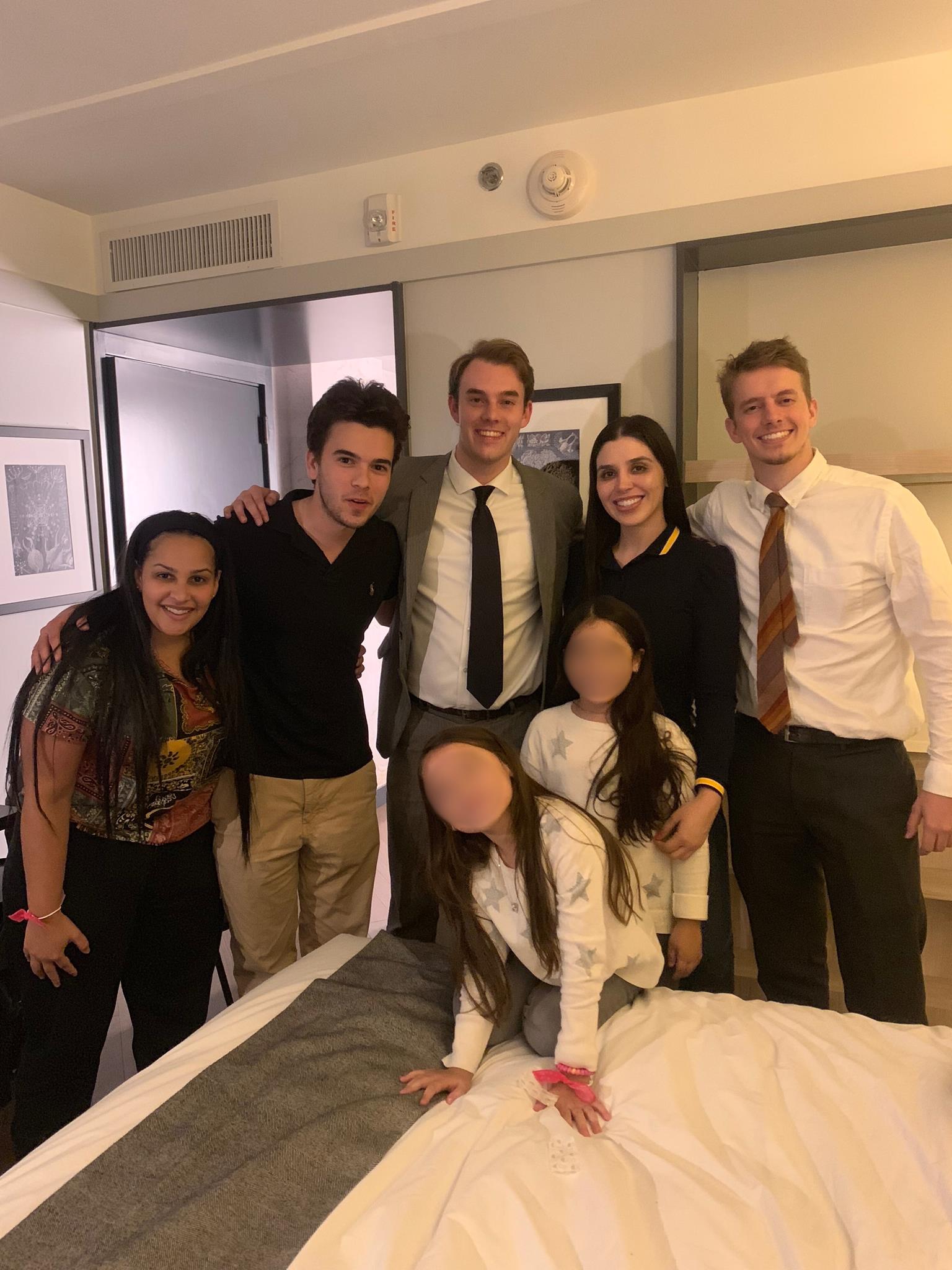 From Left to Right, Mariel Colón (El Chapo's lawyer), Cameron Penn, Spencer Judd, Emma Coronel, and Noah Evans with El Chapo and Emma's twin daughters